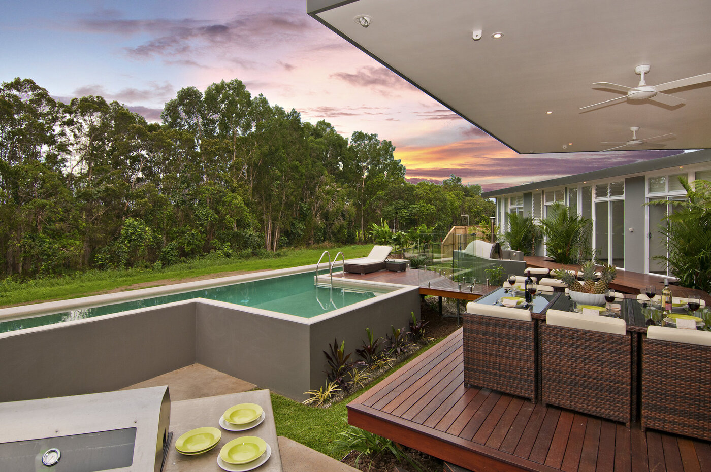 Outdoor dining area overlooking free standing pool